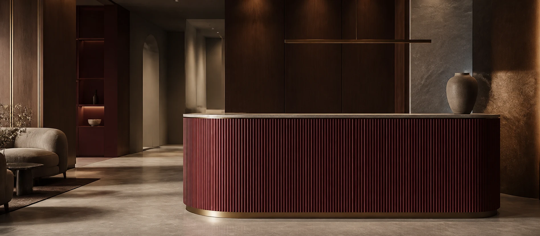 A sculptural burgundy reception desk in Novea's warmly lit clinic interior